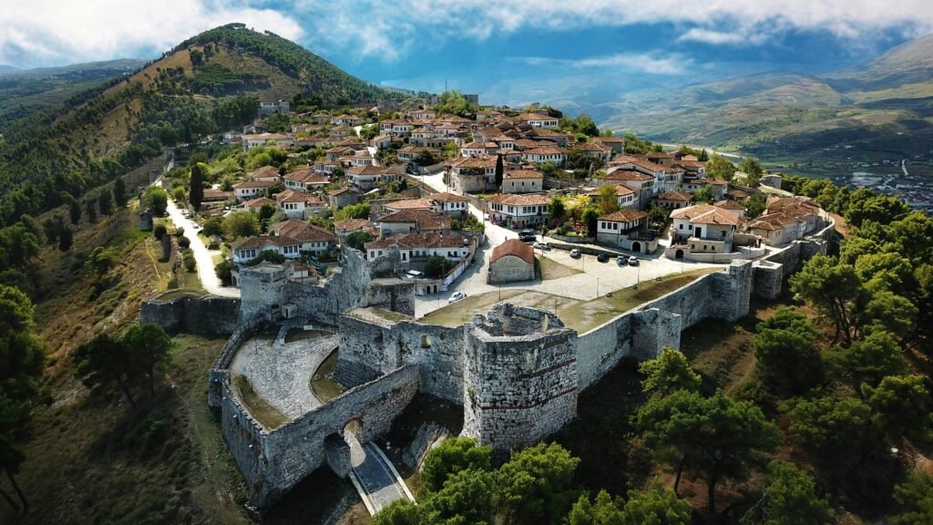 A breathtaking aerial shot of Berat Castle showcasing historic architecture and landscape.